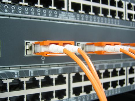 GBIC fiber optic communications switch equipment installed in large data center.