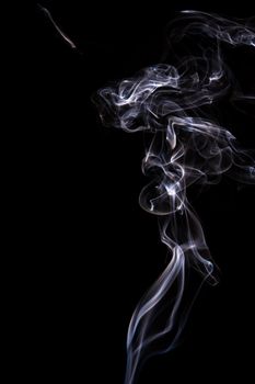 Abstract incense smoke isolated on black background