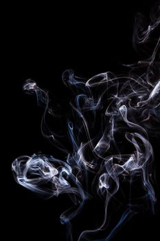 Abstract incense smoke isolated on black background