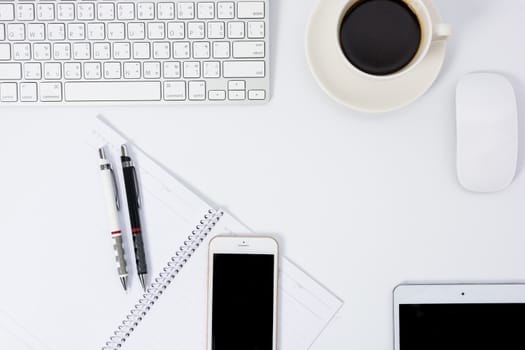 Business desk with a keyboard, mouse and pen on white table