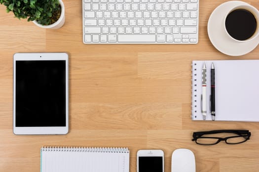 Business desk with a keyboard, mouse and pen on wooden table