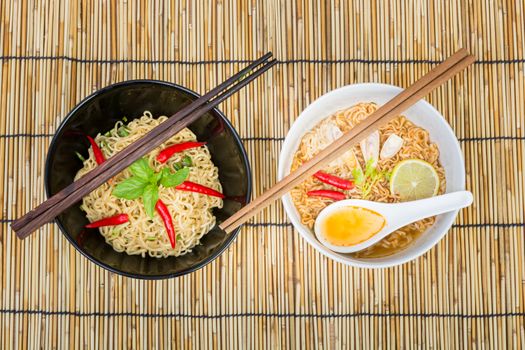 Hot and spicy instant noodle on wooden background