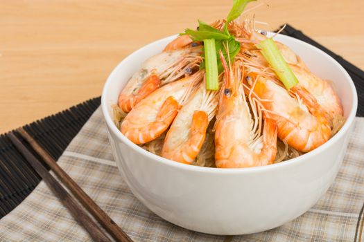 baked vermicelli with shrimp in white cup on wooden background