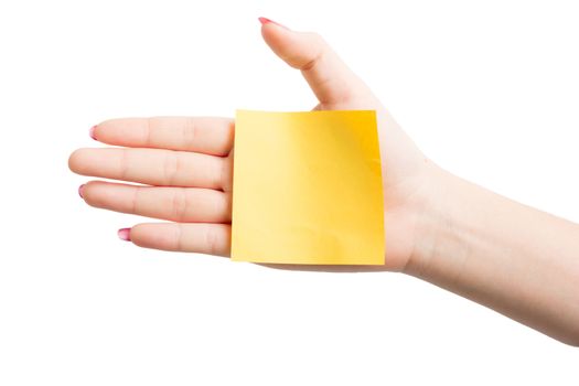 Woman hand holding blank yellow notepaper on over white background