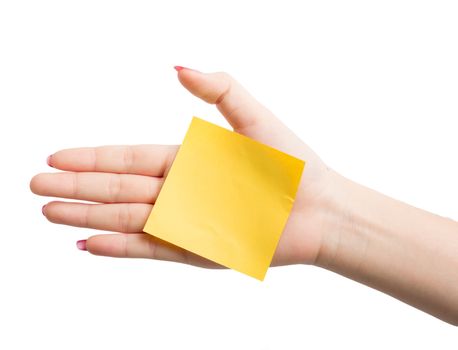 Woman hand holding blank yellow notepaper on over white background