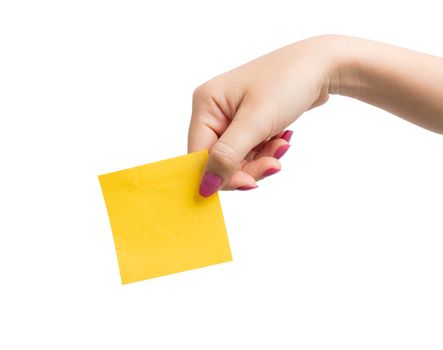 Woman hand holding blank yellow notepaper on over white background