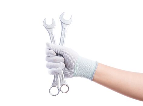 Hand gloves holding wrench. Isolated on white background