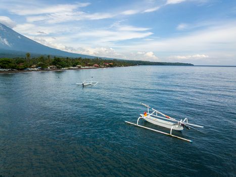 Aerial view of traditional fishing boats called jukung in Bali, Indonesia.