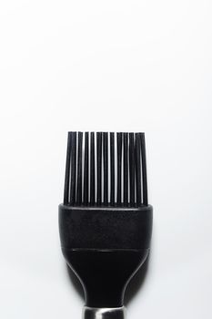 Black kitchen silicone brush on a white background