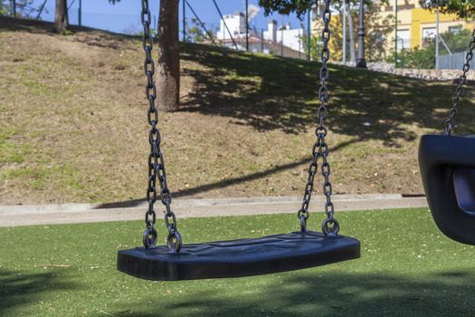 Set of chain swings on modern kids playground