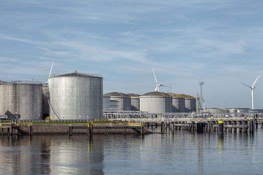 Port of Rotterdam. Botlek. Oil refinery plant from industry zone, Aerial view oil and gas industrial, Refinery factory oil storage tank and pipeline steel