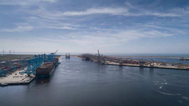 Rotterdam, Holland. Aerial view of container terminal in the harbor MAASVLAKTE, Netherlands. A large containership is unloading