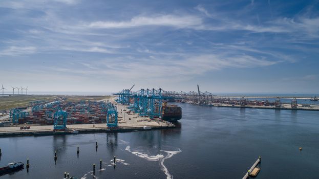 Maasvlakte 2, Rotterdam. Aerial view of container terminal in the harbor MAASVLAKTE, Netherlands. A large containership is unloading