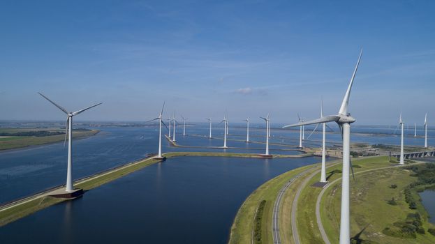 Wind turbine from aerial view, Drone view at windpark krammersluizen a windmill farm in the lake grevelingen in the Netherlands,Sustainable development, renewable energy