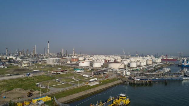 Oil refinery plant from industry zone, Aerial view oil and gas industrial, Refinery factory oil storage tank and pipeline steel