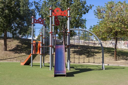 Colorful playground on yard in the park, An image of colorful children playground, without children