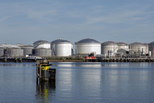 Port of Rotterdam. Botlek. Oil refinery plant from industry zone, Aerial view oil and gas industrial, Refinery factory oil storage tank and pipeline steel