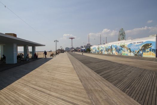 people visit famous old promenade at Coney Island, the amusement beach zone of New York, USA