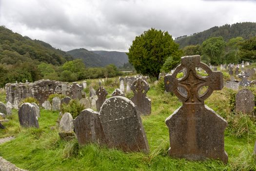 Ancient Celtic gravesite with unmarked gravestones in the middle of a meadow in rural Ireland - image