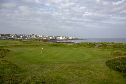 playing golf at golf course with picturesque scenery, County Kerry, Ireland - image