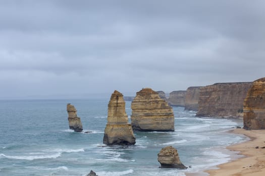 The Twelve Apostles, a famous collection of limestone stacks off the shore of the Port Campbell National Park, by the Great Ocean Road in Victoria, Australia. - Image
