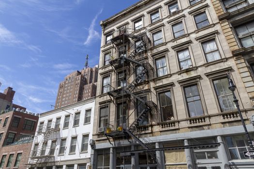 new york black Fire escape stairs-downtown back alley architecture-steel and yellow brick background