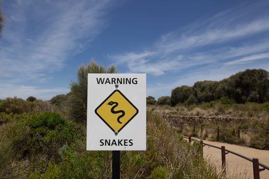 yellow snakes warning sign in the beach in Australia - Image