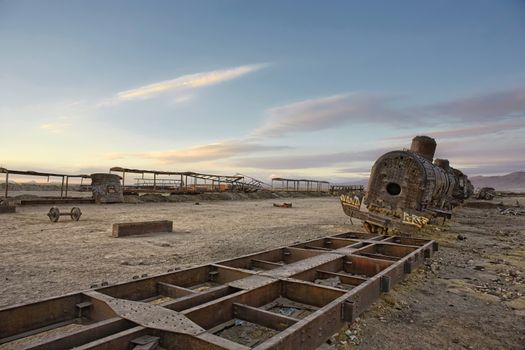 Uyuni. Low Angle View Of Blue Sky Over Old Abandoned Train At Cemetery