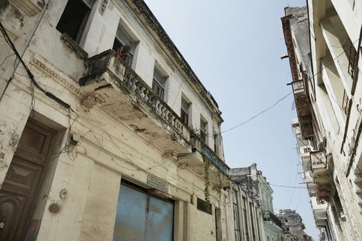 HAVANA, CUBA Typical street of Havana, Cuba, with old shabby buildings and local people