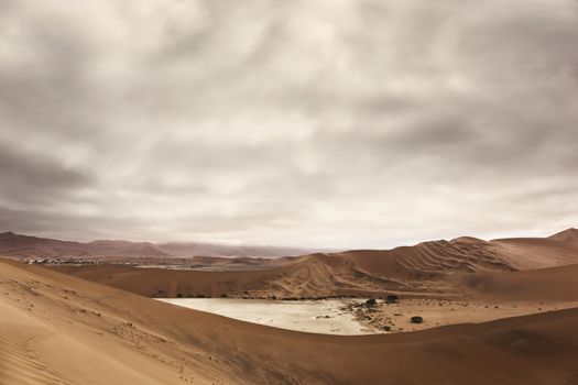 Aerial view of high red dunes, located in the Namib Desert, in the Namib-Naukluft National Park of Namibia