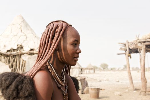 Himba tribe woman with ornaments on the neck, near Kamanjab in northern Namibia
