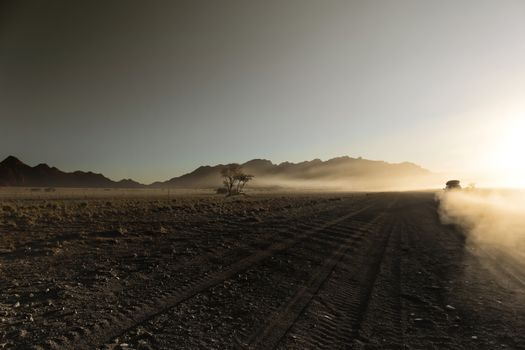 Endless empty dirt road in Namib desert of Namib-Naukluft National Park, Namibia, Africa