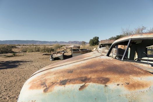 Old cars, all rusted and abandoned in the middle of the southern desert of Namibia