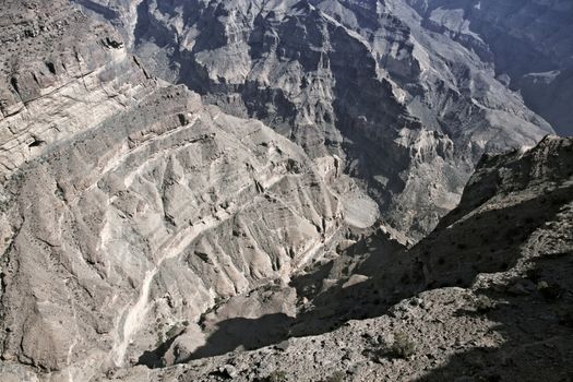 Oman's "Grand Canyon" Wadi Nakhr in the Jabal Shams mountains of northern Oman. There is a balcony trail footpath that leads to an abandoned village half way down the cliff at the end of the canyon