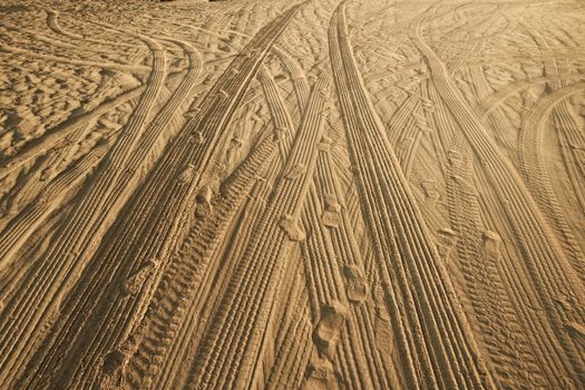 Tracks of cars on the sand in the desert