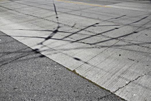 shadows electricity on a road