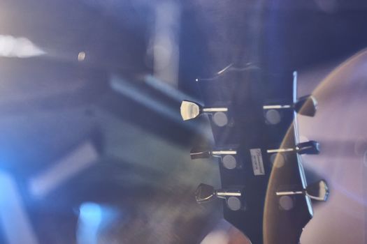 Detail of the palette and mechanics of an electric guitar taken at a live concert.