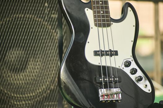 Detail of an acoustic bass in a still life shooting at a rock band concert.