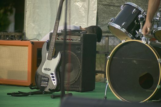Detail of an acoustic bass in a still life shooting at a rock band concert.