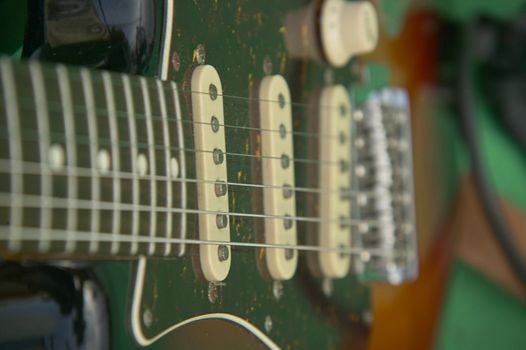 Detail of the ropes of an electric guitar in a concert of a rock band