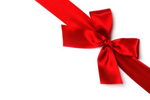 Decorative red satin bow isolated on white background