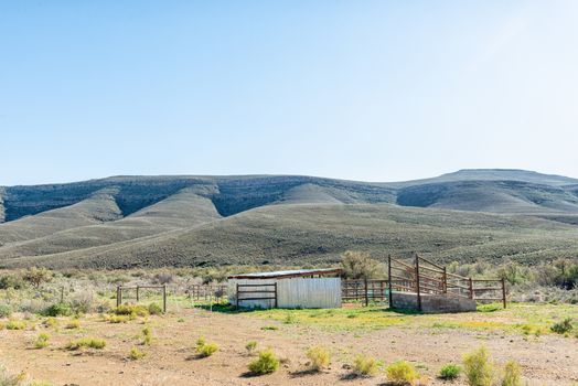 A landscape, with livestock enclosures and loading ramp, on road R356 to Ceres in the Western Cape Province