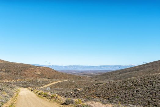 A landscape on road R356 to Ceres in the Western Cape Province. Snow is visible on Sneeuberg in the Cederberg, to the right