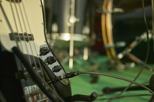 Detail of an acoustic bass in a still life shooting at a rock band concert.