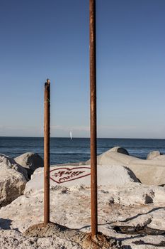 Vertical view of a glimpse of the Sottomarina dam, near Venice, during summer, tourist period for this Italian resort.