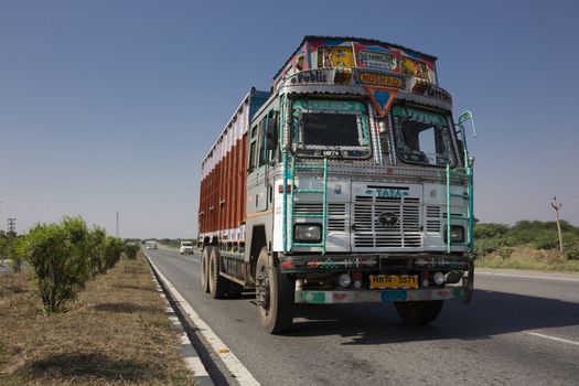 Colorful trucks brand TATA in Indian highway, india