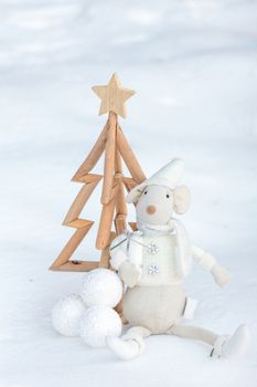 Christmas tree and decorations in the snow.  