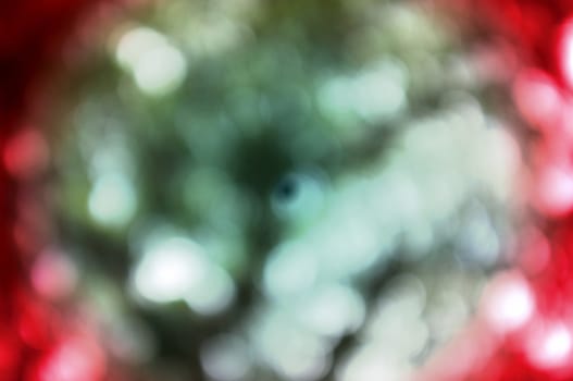 Colorful background with natural bokeh texture and defocused sparkling lights. 