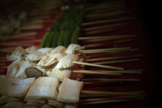 Asian street food Grilled with Chinese Sichuan Peppers (Ma-la) style , Seller prepare for meals, balls, seafoods and vegetables grill with Sichuan pepper.Thai Street food