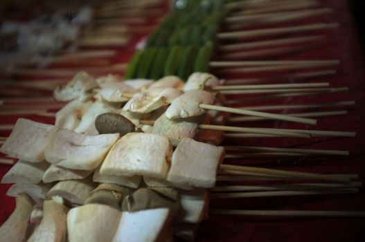 Asian street food Grilled with Chinese Sichuan Peppers (Ma-la) style , Seller prepare for meals, balls, seafoods and vegetables grill with Sichuan pepper.Thai Street food